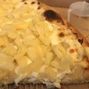 Large Half pineapple with extra pineapple on creamy garlic sauce. Don't knock it till you try it.