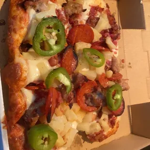 Pizza sandwich with linguica, Italian sausage, bacon, pineapple &amp; jalapeños.