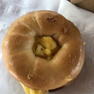 a breakfast bagel with egg