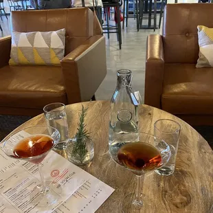 An old fashioned and manhattan in martini glasses