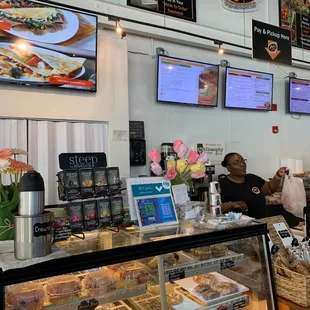 a woman behind the counter