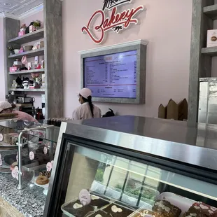 a bakery counter with a variety of pastries