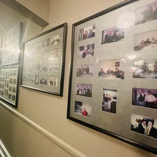 a hallway with pictures of guests