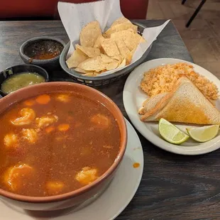 Shrimp soup served with rice and toast