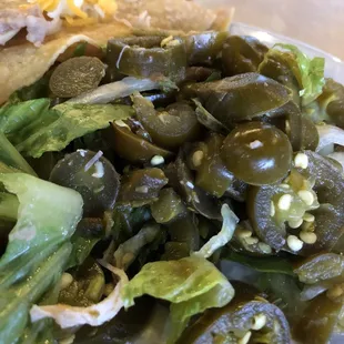 The pile of jalapeños that was in the middle of my soggy cold chicken nachos!!