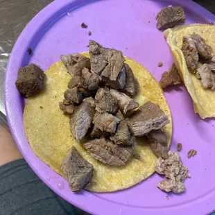 a plate of beef tacos