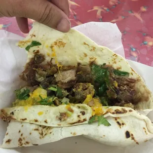 Burrito de carnitas (pork) and Tripitas ( intestines).