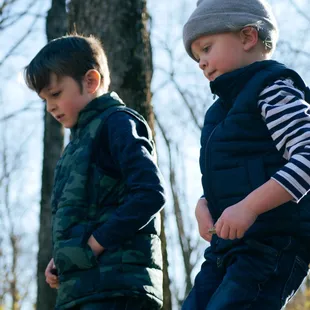 Brothers walking down the step at Ernie Miller Nature Center