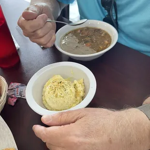 Bowl of chicken and sausage gumbo and potato salad