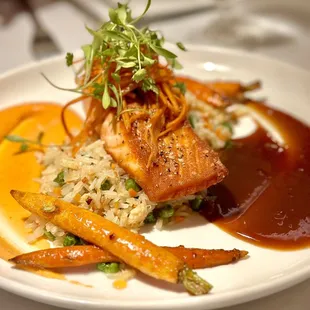 Sesame seared salmon, crab fried rice, roasted carrots, citrus soy glaze, garlic chili aioli