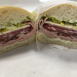 Italian sub #1 w/ pesto Mayo, lettuce, red onions, peppers, vinegar &amp; oil on ciabatta