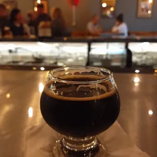 a glass of beer on a table