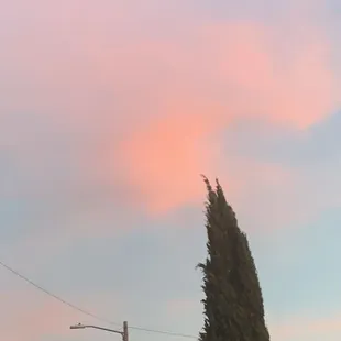 a pink cloud in the sky