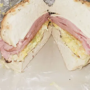 2 Meats on an onion roll with Swiss cheese