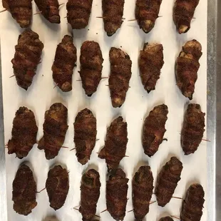 Ernie Bombs.  Jalapeños stuffed with brisket, jalapeño cheddar sausage &amp; cream cheese then wrapped in bacon