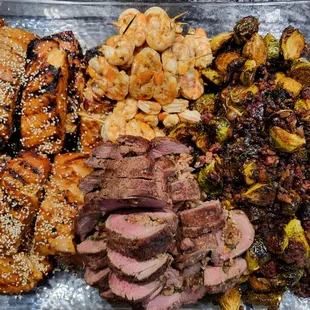 Class dinner.  Asian salmon, beef loin stuffed with bacon and spinach, mojo shrimp, balsamic glazed Brussels sprouts with chopped bacon