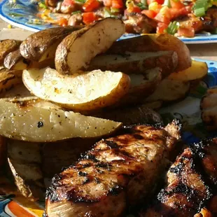Mojo marinated pork chops and seasoned potato wedges