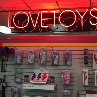 a neon sign for love toys