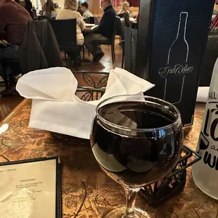 Very full glass of Cab