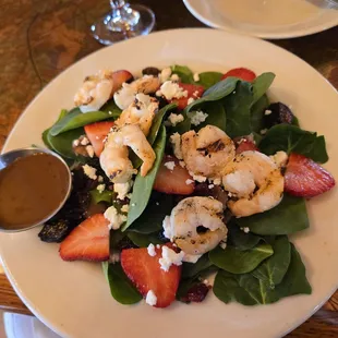 Spinach salad with add-on shrimp.