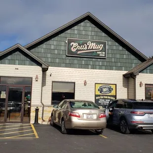 cars parked in front of a restaurant