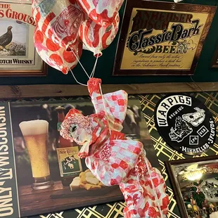 a bunch of beer balloons hanging from the ceiling
