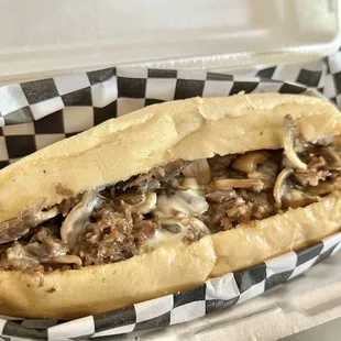 Mushrooms Cheese Steak Philly with a side of whiz in the back