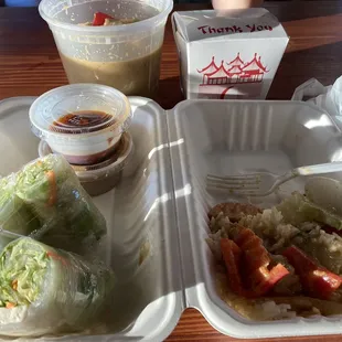 Yellow curry with chicken, salad rolls