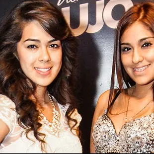 two young women posing for a picture