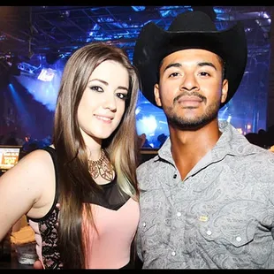 a man and a woman at a concert