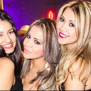 three women at a bar