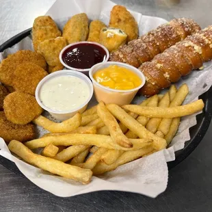 Appetizer sampler with fried pickles, jalapeno poppers, Bavarian soft pretzels, &amp; french fries
