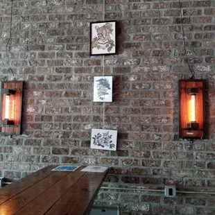 a brick wall with a wooden table