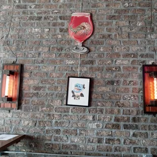 a brick wall with a red flag hanging on it