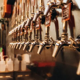 a row of beer taps