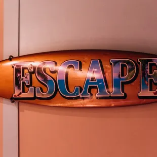 a surfboard hanging on a wall