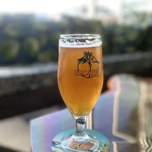 a glass of beer on a table