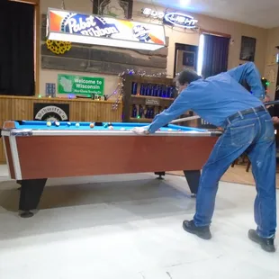 The pool table in back.