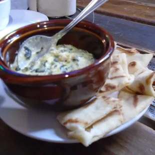 Smoked gouda spinach artichoke dip with flat bread.