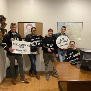 What's in this photo? Just some good looking guys working together to solve a puzzle