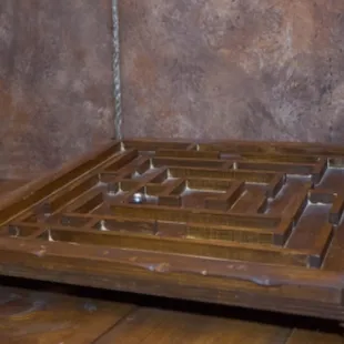 There are a lot of puzzles hidden in every room. You and your team need to find and solve them in order to escape.