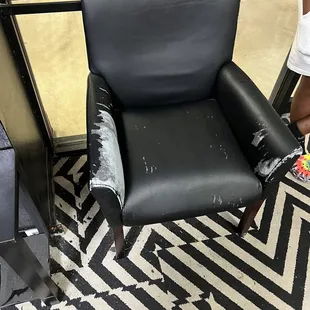 All of the chairs at the entry lobby were extremely worn and in need of replacement.