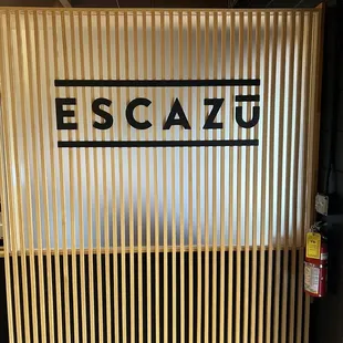 the escazu logo on the wall