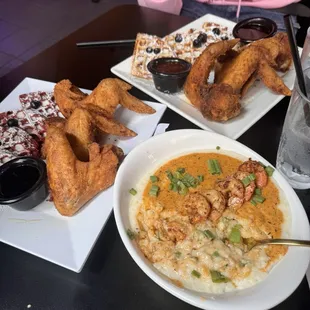 Shrimp and Grits and chicken with waffles.