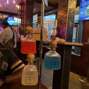 a man sitting at a table with drinks