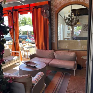 a living room with a couch and chairs