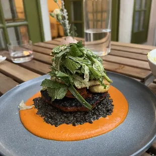 a plate of food on a wooden table
