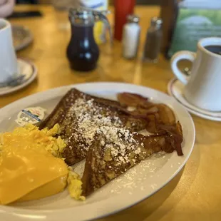 French Toast platter with scrambled eggs with cheese and bacon