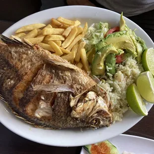 a plate of fish, rice, and vegetables