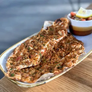 Fındık Lahmacun: Flatbread w/ angus ground beef, tomatoes, onions, parsley, sumac onions-tomato salad (part of kebap trio)